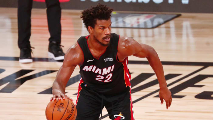 Miami Heat forward Jimmy Butler (22) dribbles as forward Jae Crowder (99) blocks Los Angeles Lakers forward LeBron James (23) during the fourth quarter of game three of the 2020 NBA Finals